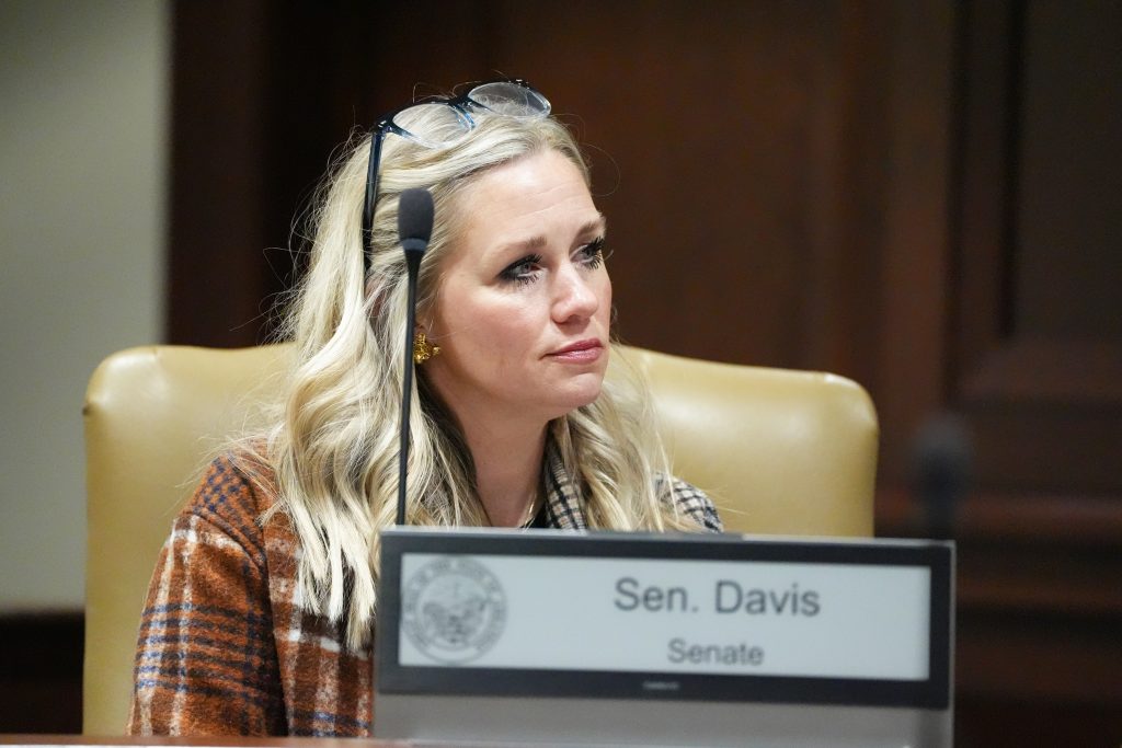 Senator Davis listens during a committee meeting