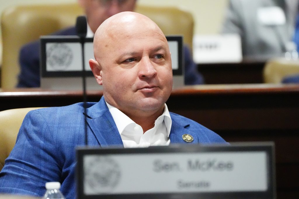 Senator McKee listens to the proceedings in a committee meeting
