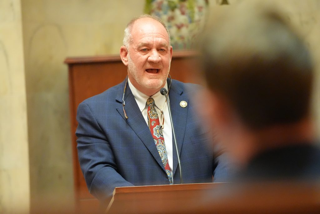 Senator Jimmy Hickey, Jr., speaks from The Well in the Senate chamber during a business meeting
