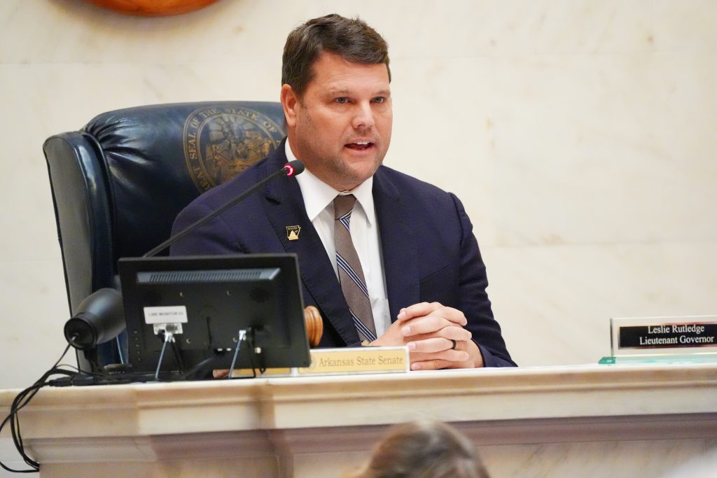 Senator Hester speaks from the dais in the Senate chamber