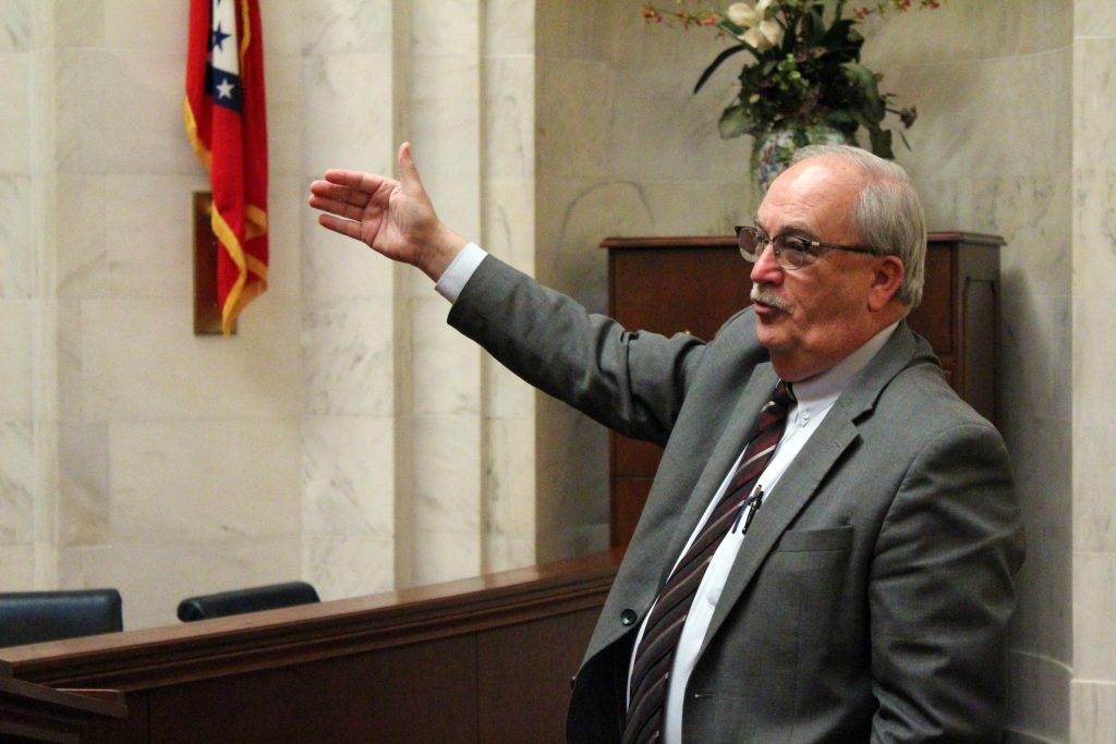 Senator Hammer gestures while speaking to a tour group in the Senate chamber
