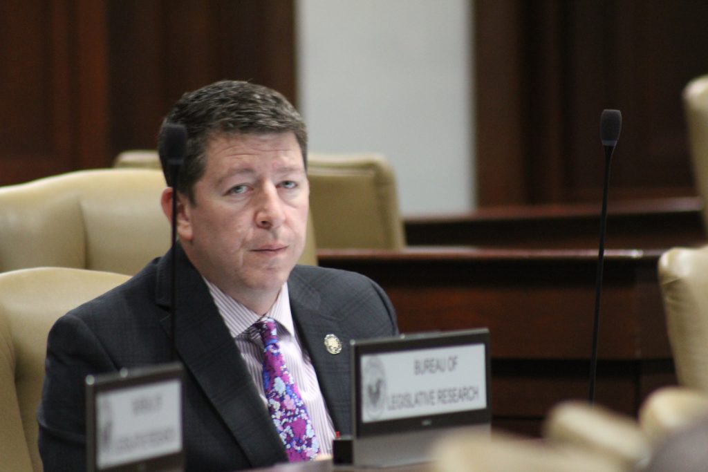 Senator Bryant listens during a committee meeting