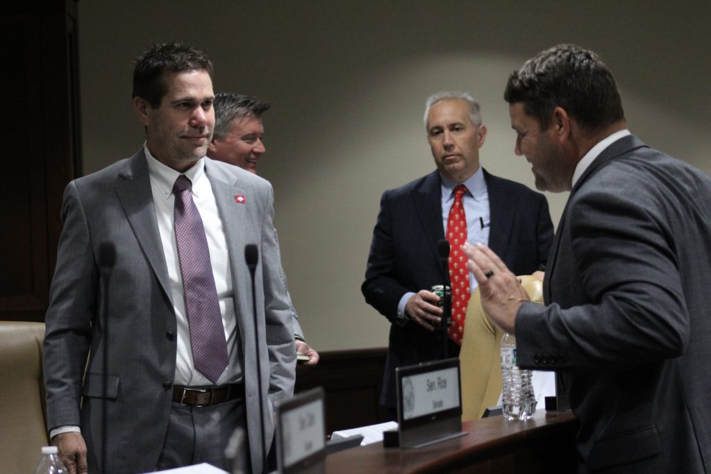 Brad Simon talks with Senator Hester before a committee meeting