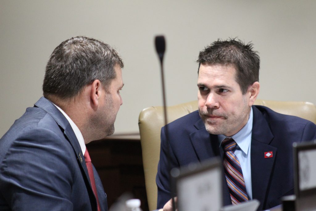Brad Simon talks with Senator Hester before a committee meeting