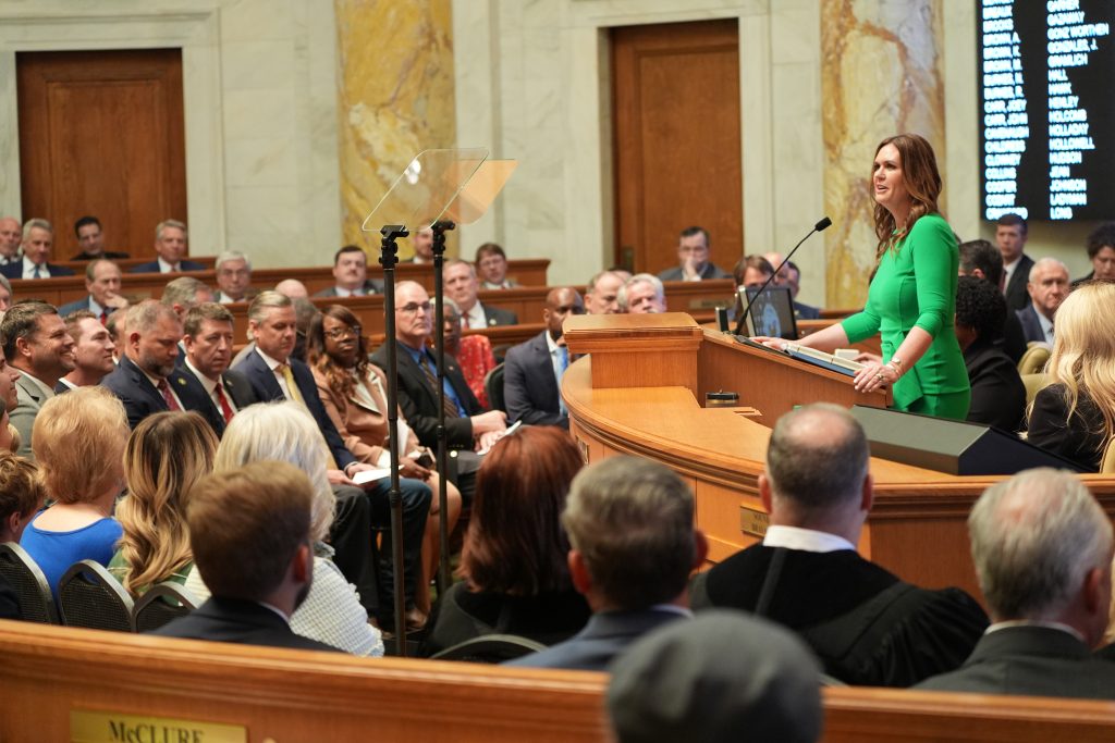 Governor Sanders speaks to the combined Arkansas General Assembly. Senators are seated on the front row.