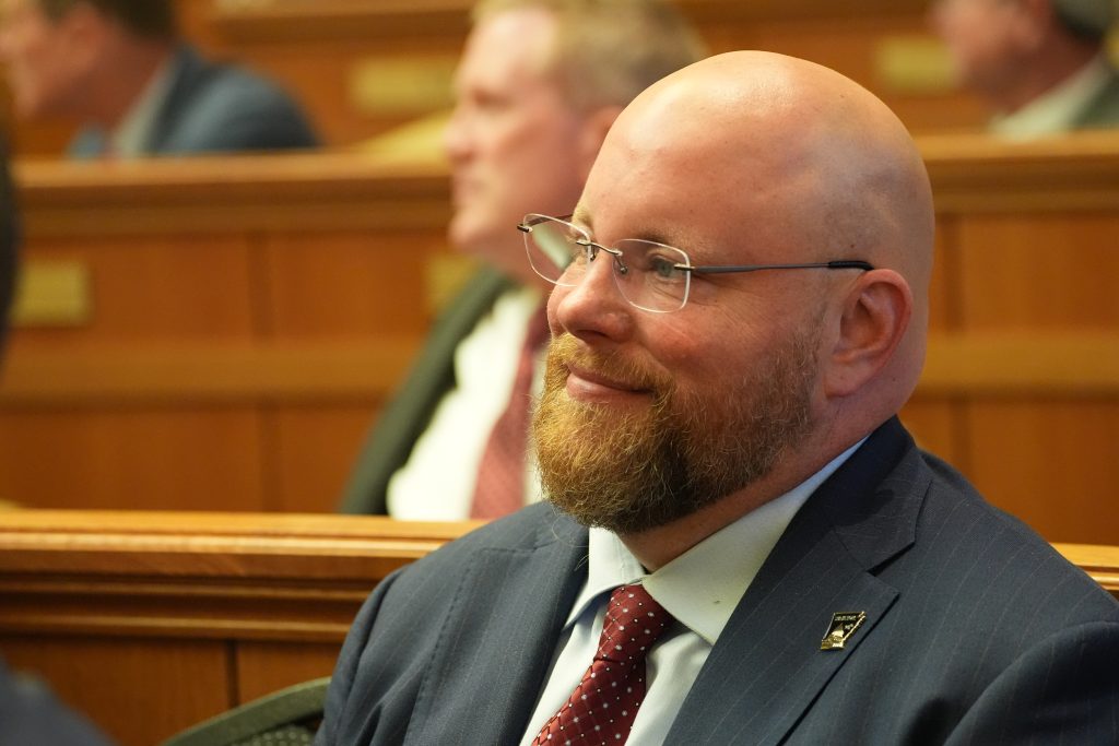 Senator Crowell smiles while listening to the State of the State address