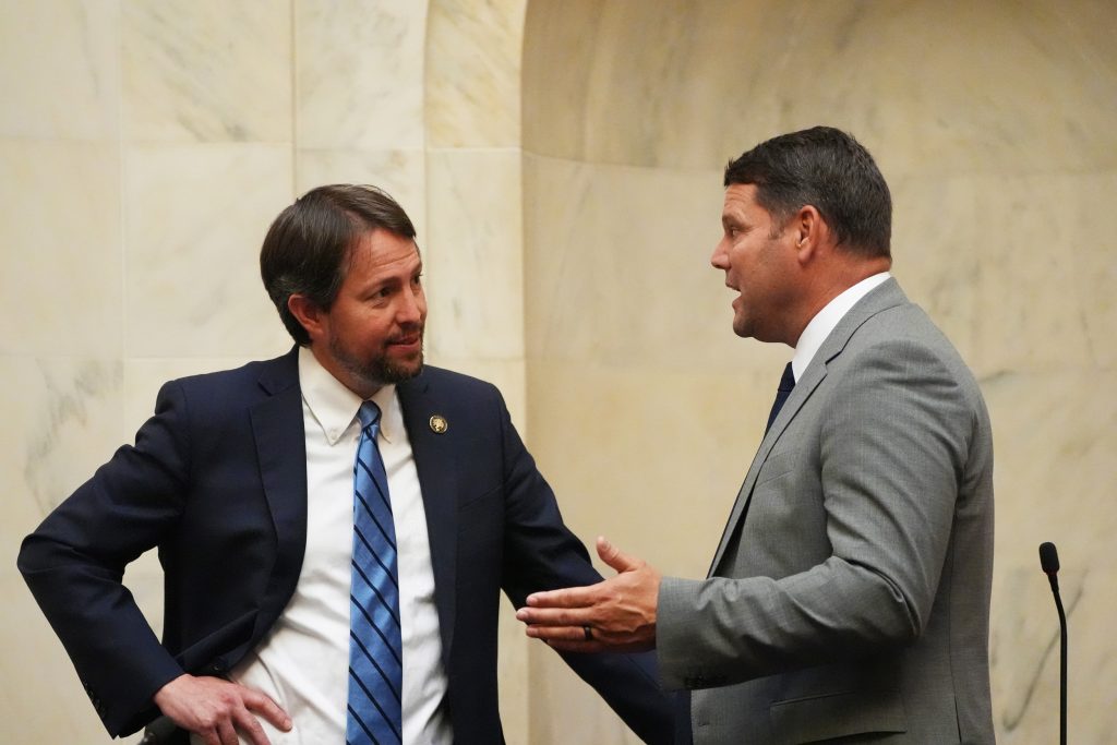 Senators Tucker and Hester talk in the Senate chamber