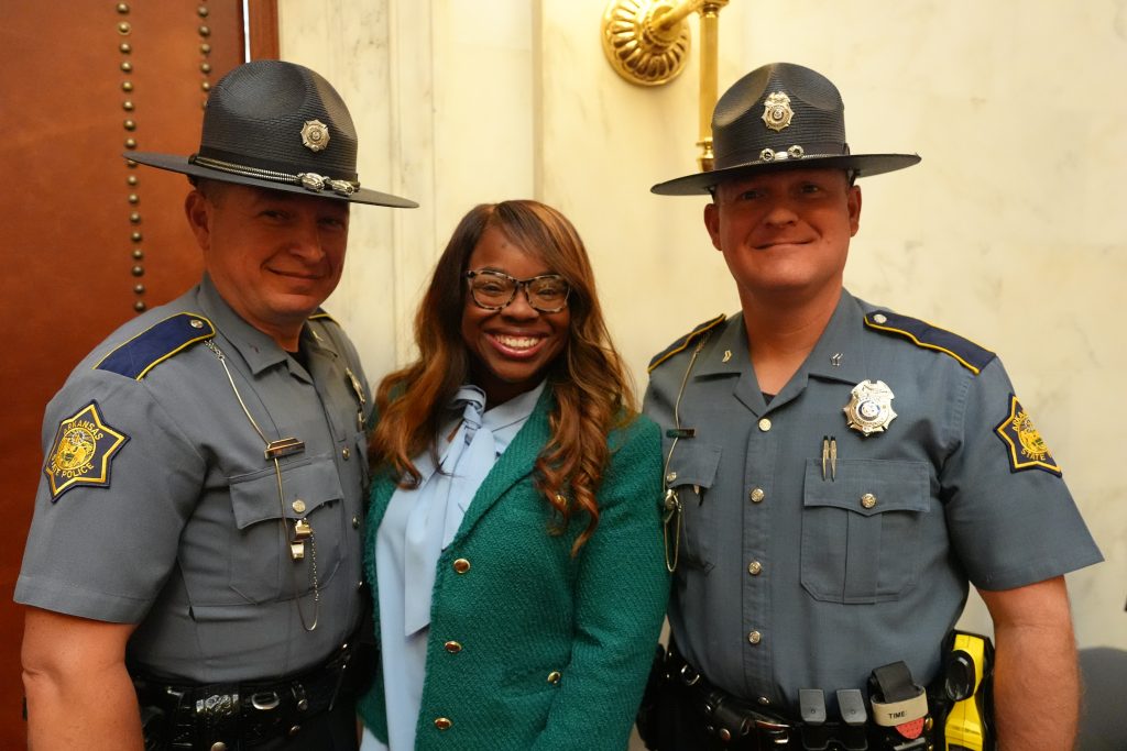 Senator Scott poses with two State Troopers in the Senate chamber