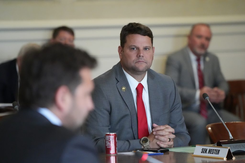 Senator Hester listens to testimony in a committee meeting in the Old Supreme Court room