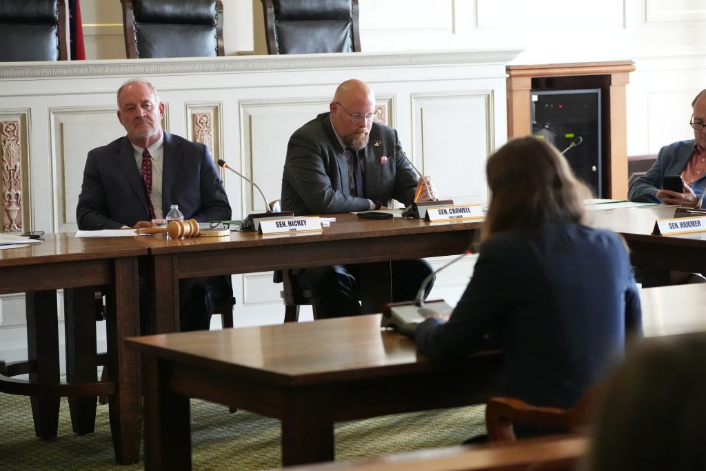 Sens Higkey and Crowell in a committee meeting in the Old Supreme Court room