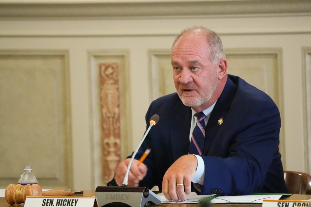 Senator Hickey talks during a committee meeting in the Old Supreme Court chamber