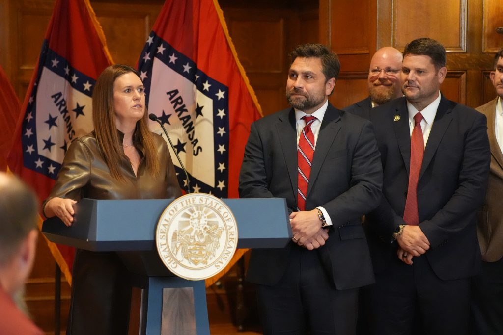 Senators Dismang, Hester, and Crowell stand beside Governor Sanders during a press conference for the 2026 special session