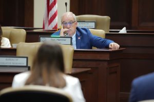 Senator Hammer listens to testimony in a committee room