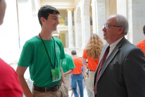 Senator Hammer talks with a Boys State delegate outside the Senate chamber.