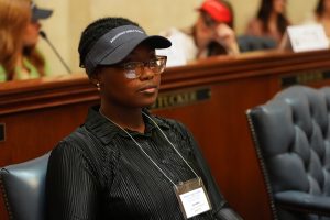 A Girls State delegate listens in the Senate chamber
